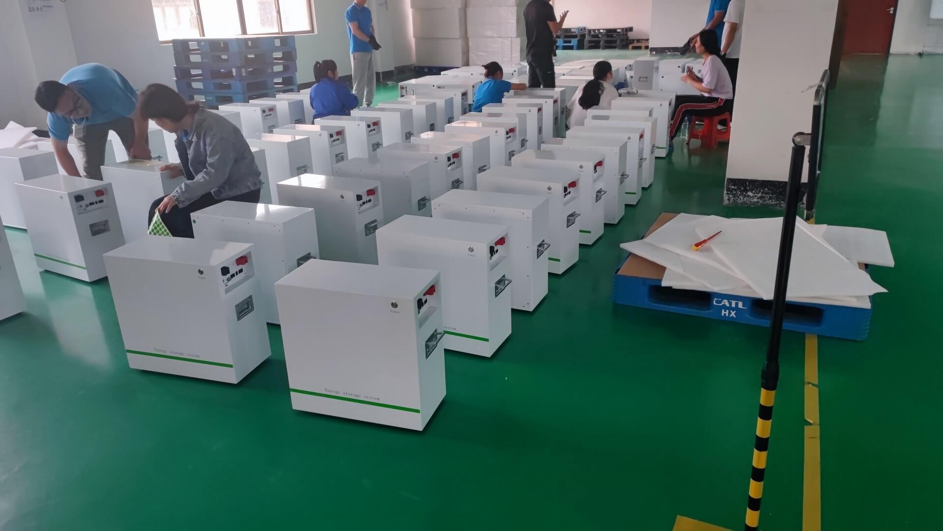 Warehouse personnel are checking the appearance of the lifepo4 48v battery pack